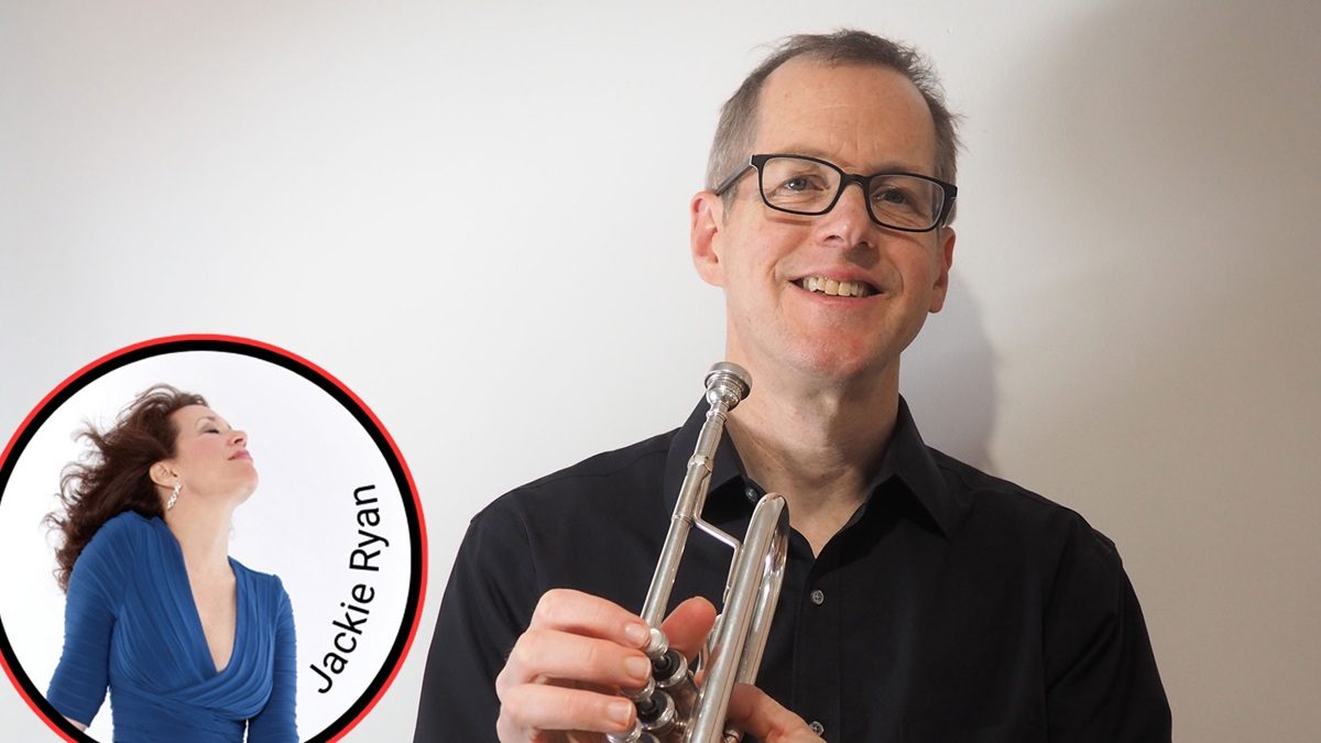 A man wearing glasses and a black shirt is smiling while holding a silver trumpet. In the lower left corner, there is a circular inset image of a woman with long brown hair wearing a blue dress, with the name "Jackie Ryan" written along the edge.