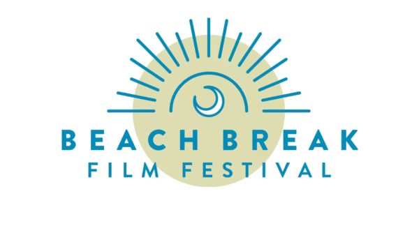 Logo for the Beach Break Film Festival featuring a stylized blue crescent wave inside a semicircle with radiating blue lines above a pale yellow circle background. The text "BEACH BREAK" is in bold blue uppercase letters, with "FILM FESTIVAL" in smaller blue uppercase letters below.