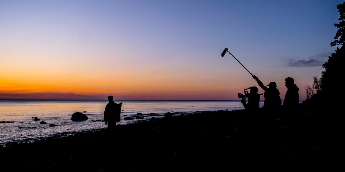 Filming crew next to the sea