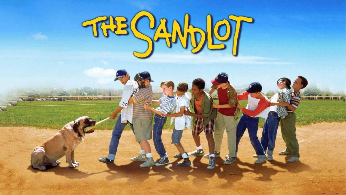 The Sandlot title over children in a tug-of-war with a dog on a baseball field